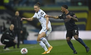 Luke Ayling comes up against Raheem Sterling.