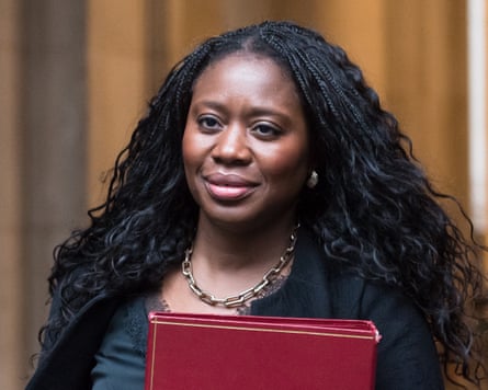 Miatta Fahnbulleh carries a red ministerial folder