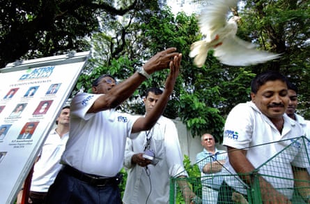Sri Lankan members of Action Against Hunger (ACF) release birds to commemorate the death of their colleagues three months previously, in Colombo, Sri Lanka, 6 November 2006.