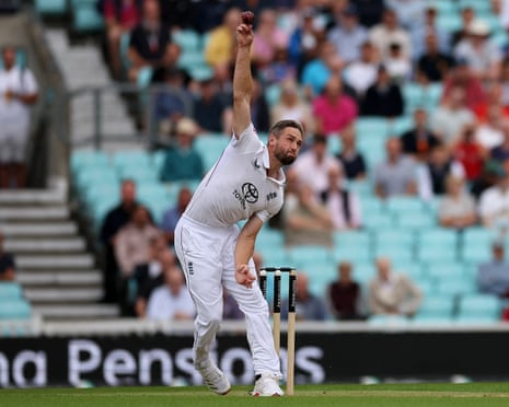England's Chris Woakes bowls on the first day of the fifth Test cricket match between England and India at The Oval.