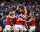 Brisbane Lions complete third straight AFL premiership with late comeback over Fremantle at MCG