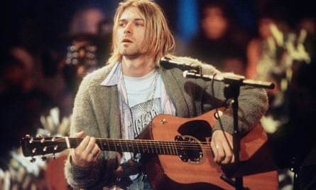 Cobain unbuttoned: wearing the £93,000 cardigan during the recording of MTV Unplugged in 1993.