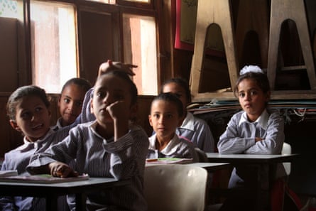 Children in Khan al-Ahmar attend a school lesson