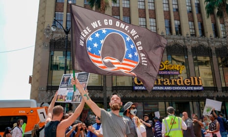 Conspiracy theorist QAnon demonstrators on Hollywood Boulevard in Los Angeles, California, on 22 August.