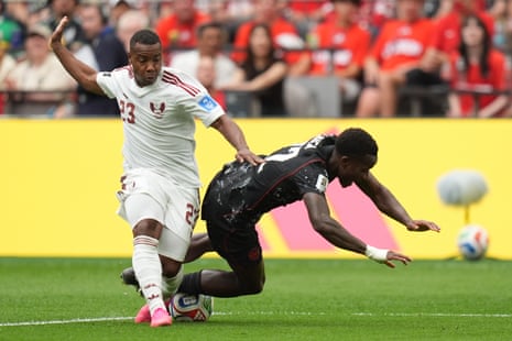 Richie Laryea goes down under a challenge from Assim Madibo.