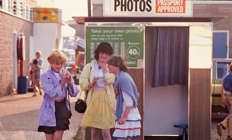 Snap happy: having a picture taken in a photobooth at Butlins holiday camp, Skegness, in 1982.
