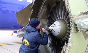 National Transportation Safety Board investigator Jean-Pierre Scarfo examines damage to the CFM56-7B engine on Southwest Airlines flight 1380.