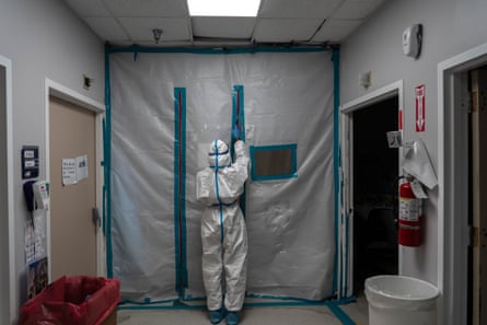 A medical staff member exits the Covid-19 intensive care unit at a hospital in Houston.