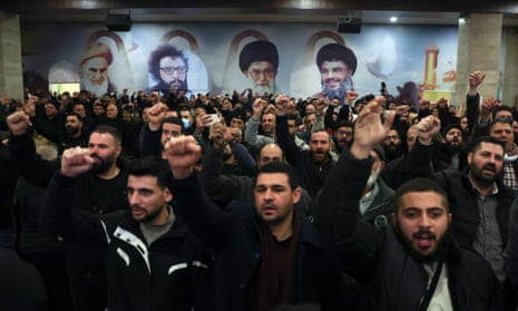 Hezbollah supporters gesturing as Hassan Nasrallah gave his televised address.