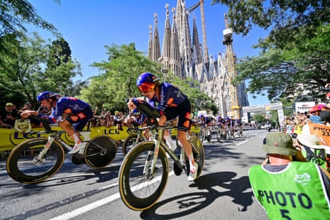 Team Picnic PostNL riders head past Sagrada Familia.