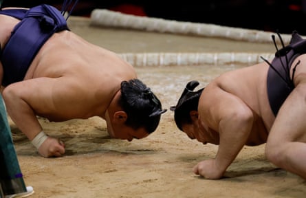 Hoshoryu (left) and Kirishima try to intimidate each other as they face up just before starting their bout, which Hoshoryu won.