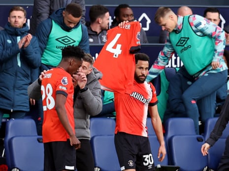 Luton Town's Andros Townsend celebrates scoring their first goal by holding a shirt to support of Luton Town's Tom Lockyer who is recovering following a cardiac arrest.