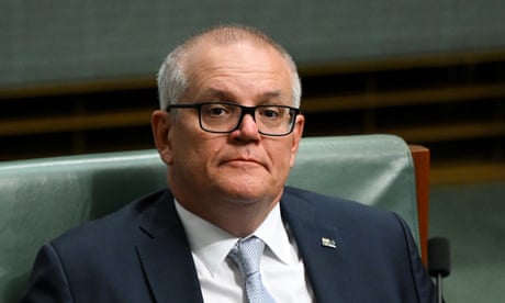 The former prime minister, Scott Morrison, sitting in parliament