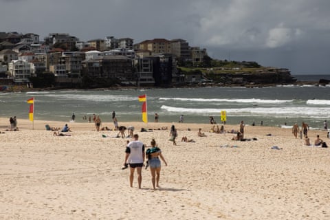 After weeks of rain, beachgoers brave polluted waters at Bondi Beach in Sydney.