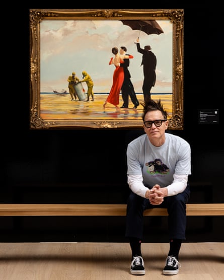 Blink-182’s Mark Hoppus poses by Banksy’s “Crude Oil (Vettriano)“ at Sotheby’s on 2 March 2025 in London, England. The rare painting came from Hoppus’ collection and portion of the proceeds was donated to medical charities and the LA Fire Foundation.