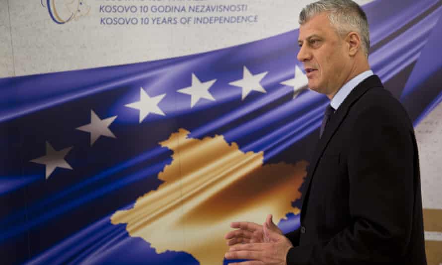 Kosovo’s president, Hashim Thaçi, stands in front of a banner marking the 10th anniversary of Kosovo independence