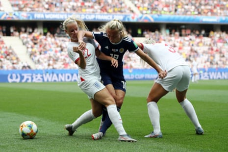 Beth Mead and Alex Greenwood of England put pressure on Claire Emslie of Scotland.