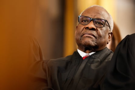a man in a black robe looks grumpily to the side