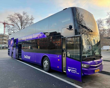 a new luxury sleeper bus painted purple to use in Europe