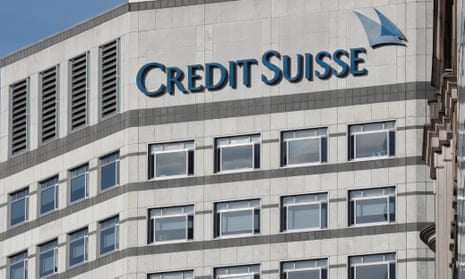 The Credit Suisse logo is seen at their offices at the Canary Wharf financial district in London.