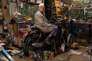 A motorbike mechanic in Mussoorie’s Landour Bazaar