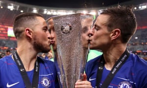 Chelsea’s Eden Hazard (left) and Cesar Azpilicueta celebrate with the trophy.