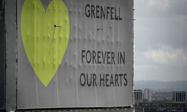 A banner reading ‘Grenfell: forever in our hearts’ wrapped around the tower block