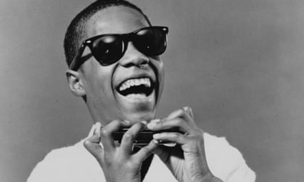 Stevie Wonder, with harmonica, in 1964.