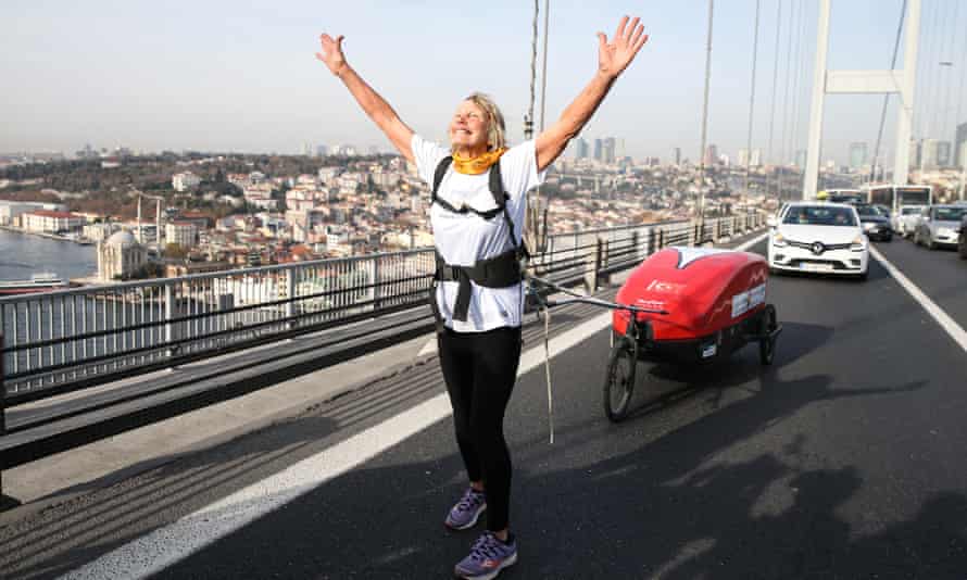 Rosie Swale Pope crossing the Bosphorus Bridge in Istanbul, in 2019, towing her belongings behind her.