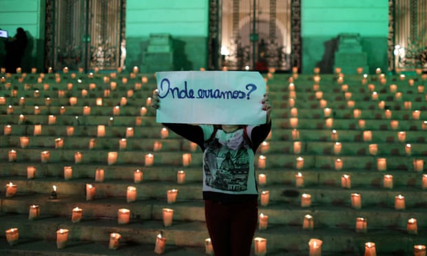 A woman holds a sign during an event to light candles in honour of the 500,000 people who have died from coronavirus in Brazil, in Rio de Janeiro this week. The sign reads: ‘Where did we go wrong?’