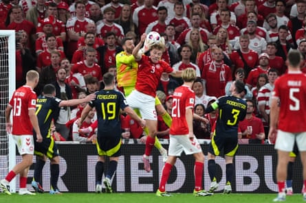 The Scotland goalkeeper, Angus Gunn, collects the ball during the World Cup qualifier against Denmark at Parken Stadium.