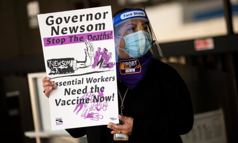 Protesters attend a rally to have airline and airport workers considered essential and eligible for a Covid vaccine.