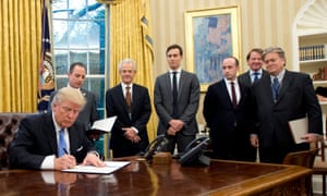 Donald Trump signs an executive order reintroducing the Mexico City policy