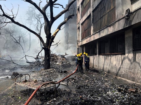 Firefighters work at the site of an aircraft that crashed in India's northwestern city of Ahmedabad in Gujarat state, on Thursday.