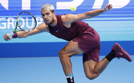 Carlos Alcaraz returns a shot against Taylor Fritz during the Japan Open final.