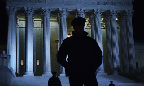 Police stand outside the supreme court in Washington.