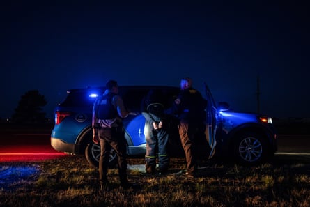 Sheriff’s deputies detain a man