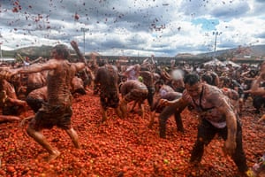 People participate in the tenth annual Tomato Fight Festival, known as “Tomatina”, in Sutamarchan, Boyaca Department, Colombia
