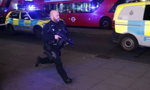 An armed policeman runs down Oxford Street to respond to an incident in November – which turned out to be a fist fight.