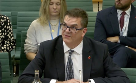 Olly Robbins sat in front of the committee wearing a dark suit