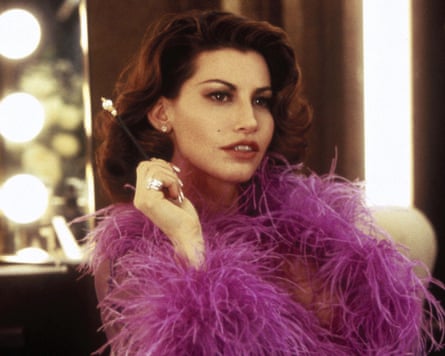 Wearing a frilly purple top in a dressing room