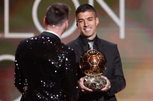 Luis Suarez presents the Ballon d’Or award to his former teammate Lionel Messi.