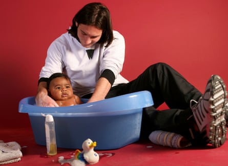 Lionel Messi helps to bathe Lamine Yamal during a photo session in the dressing room of the Camp Nou in Barcelona.