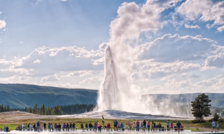 The Old Faithful geyser erupts at Yellowstone national park.