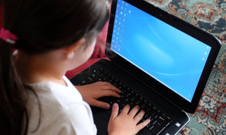 A child using a laptop computer
