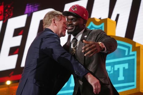 Jeremiyah Love, right, embraces NFL commissioner Roger Goodell after being chosen by the Arizona Cardinals.