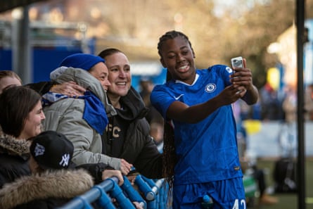 Chloe Sarwie takes a selfie with fans.
