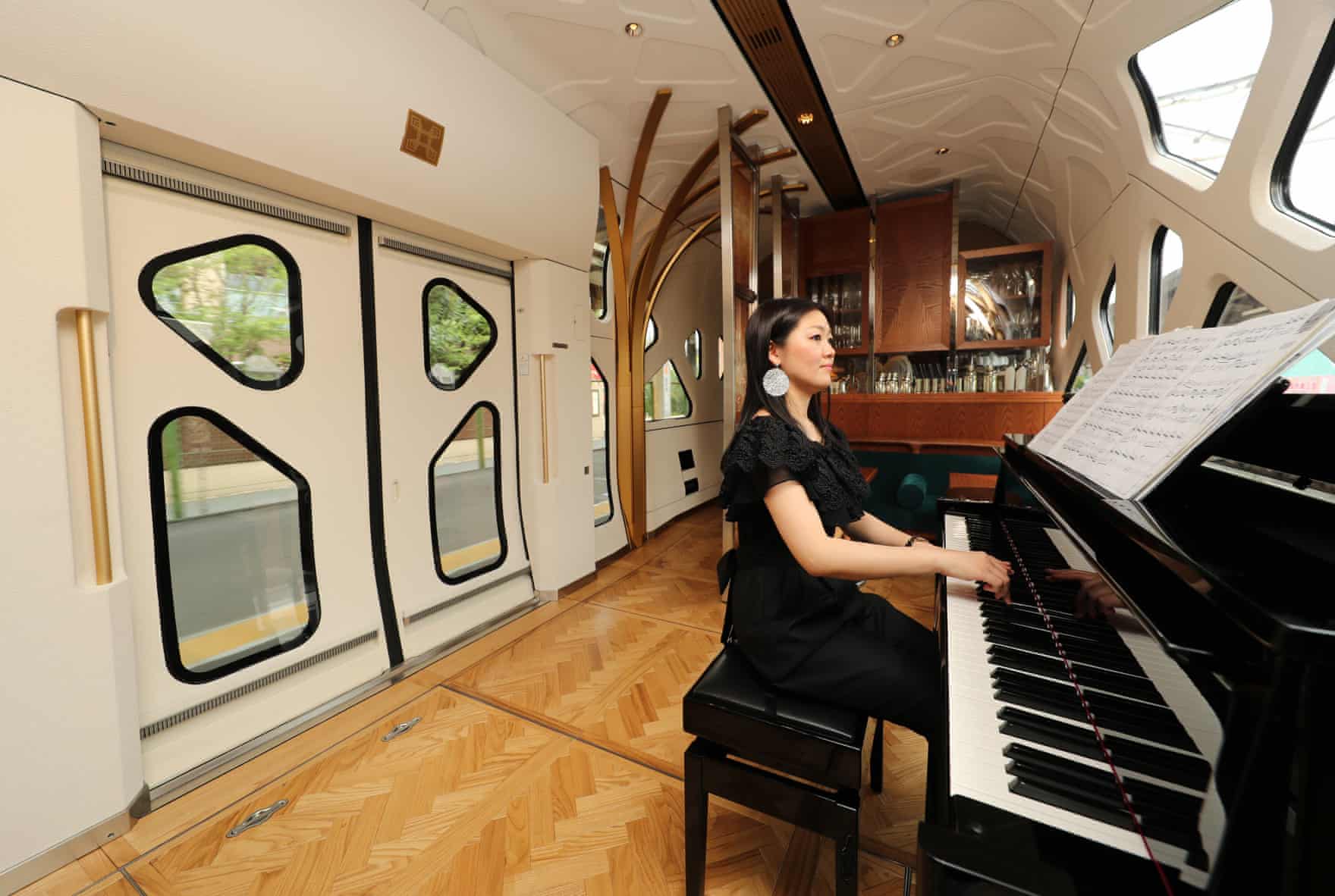 A pianist entertains passengers in the lounge