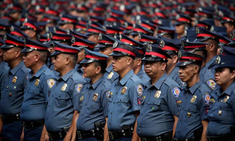 Newly promoted police officers in formation during a ceremony police HQ in Taguig city, south of Manila.
