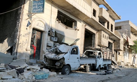 A damaged vehicle after a Syrian army helicopter belonging hit a residential area in Aleppo with barrel bombs.